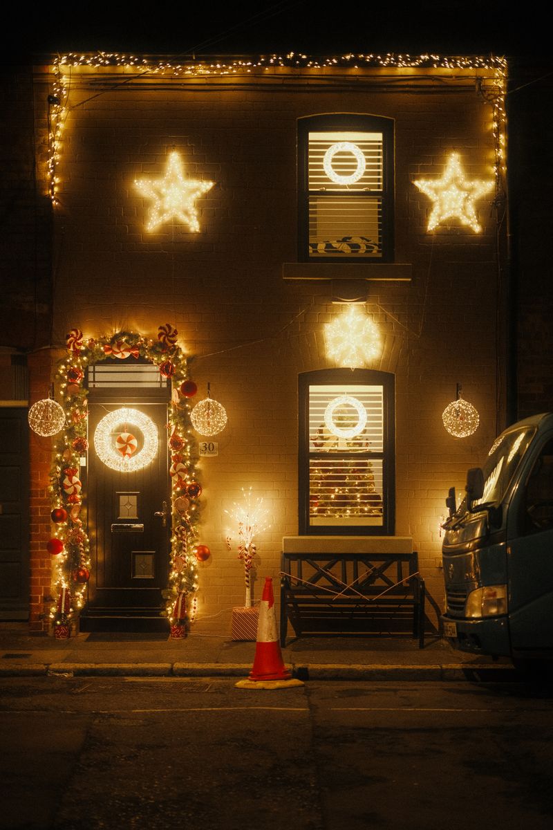House decorated with glowing golden Christmas lights